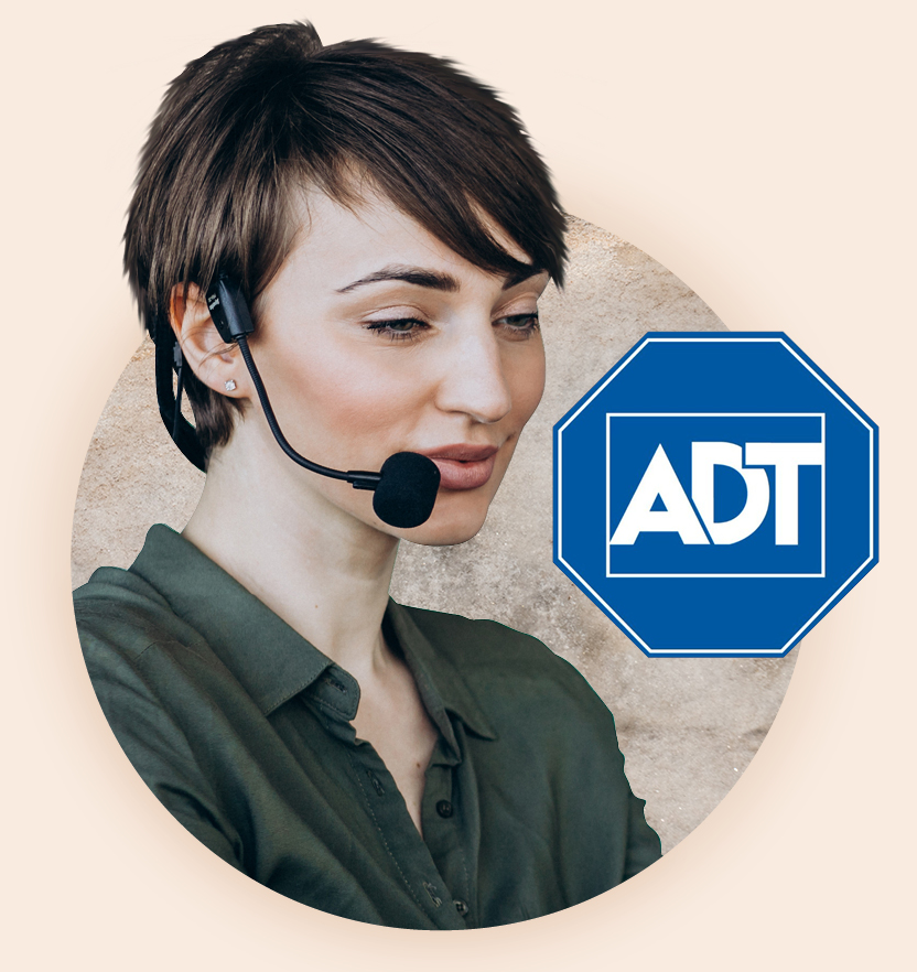 An alarm receiving centre agent wearing a headset microphone positioned next to the ADT logo